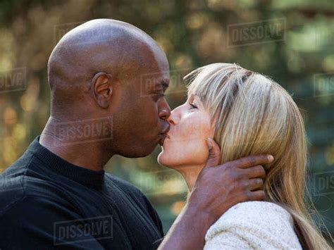 Interracial Married Couple Kissing In A Park Edmonton Alberta Canada