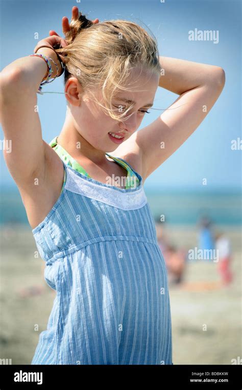 Royalty Free Photograph Of Girl On Beach In The Summer With Sun