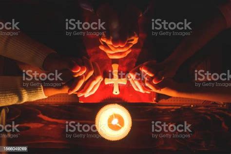 Group Of People Holding Hands Praying Worship Believe With Lighting