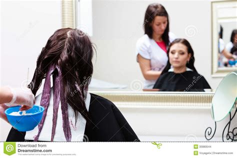 Hairdresser Applying Color Female Customer At Salon Doing Hair Dye