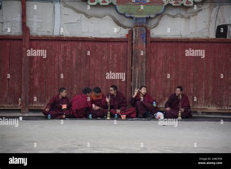 Buddhist Monks With Tibetan Flutes Inside Sakya Monastery Tingri