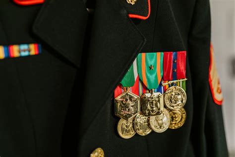 Close Up Photo Of Navy Uniform With Gold Medals · Free Stock Photo