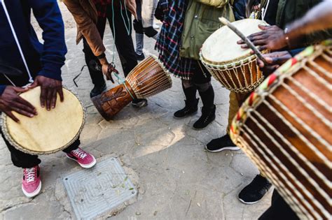 premium photo african drummers blowing their bongos on the street