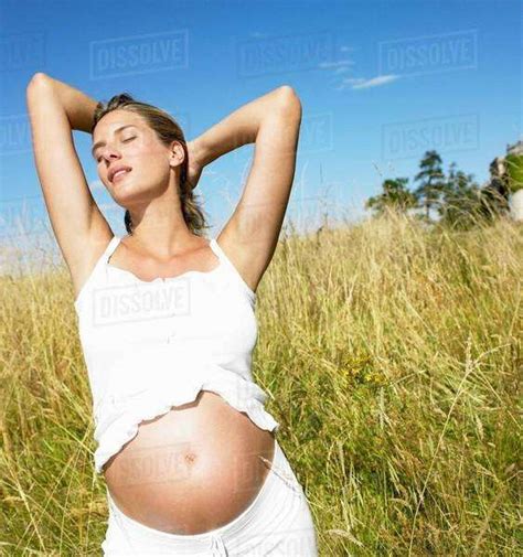 Pregnant Woman In A Field Stock Photo Dissolve