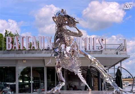 Giant Chrome T Rex Installed On The Seine River In Paris By Philippe