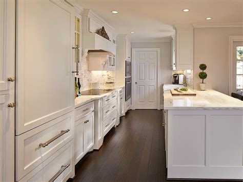 Gallery featuring images of 34 kitchens with dark wood floors. Beautiful Traditional Kitchen White Cabinetry & Dark ...