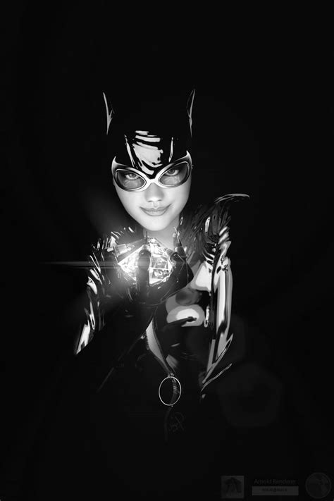 A Woman Dressed As Catwoman Holding A Flashlight