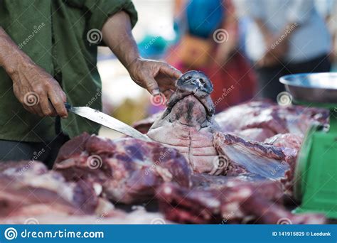 Vietnamese Butcher With A Piece Of Pig Meat Meatman Cutting Pig Snout