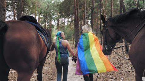 Lgbt Rainbow Flag Same Sex Love Young Lesbian Same Sex Couple Is Engaged In Joint Hobby
