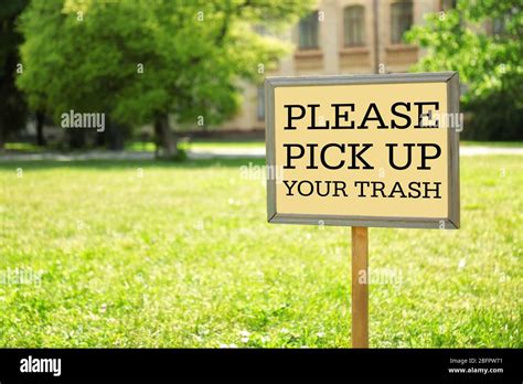Signboard With Text Please Pick Up Your Trash At Park Stock Photo Alamy