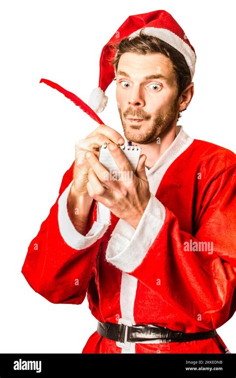 isolated photo of santa s little helper with elf ears writing christmas list with quill and
