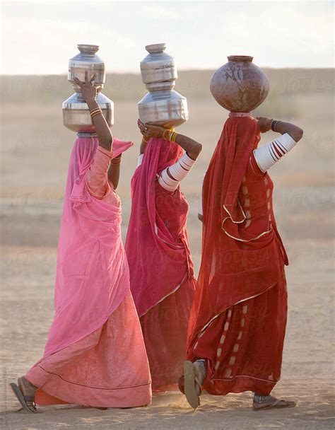 Women Carrying Water Jugs Rajasthan India By Stocksy Contributor