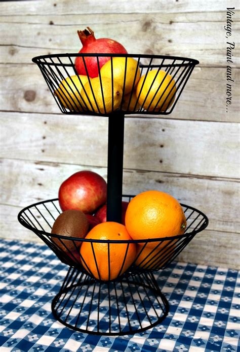 When you need outdoor decor on a tight budget you create your own like this diy wire basket outdoor table. Two Tier DIY Wire Basket | Vintage, Paint and more...
