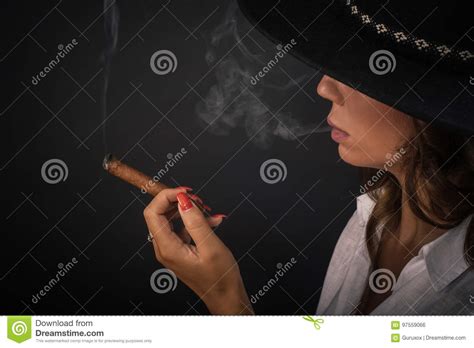 Portrait Of Elegant Lady Woman With Hat Smoking Cigar Stock Photo