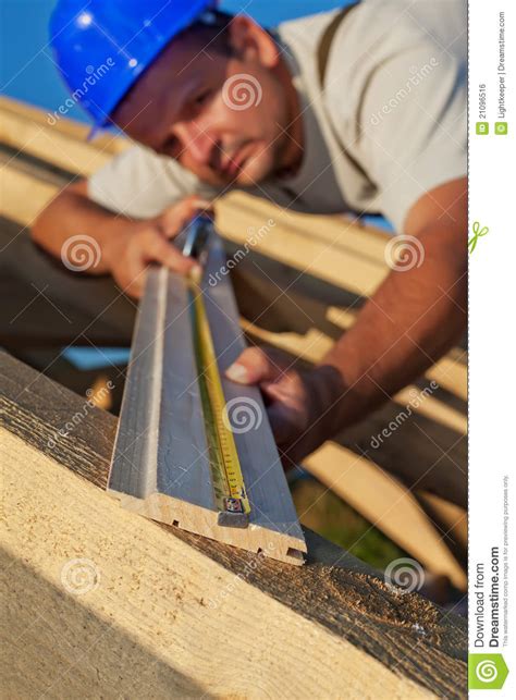 carpenter measuring wood planck royalty  stock image