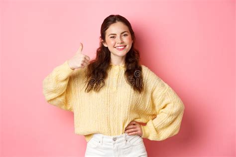 Image Of Confident Smiling Girl Shows Her Support Makes Thumbs Up In