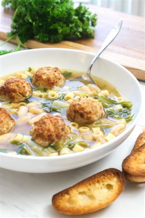Escarole & white bean soup from delish.com is healthy dinner that doesn't taste like it. Escarole and Bean Soup with Meatballs - Daily Appetite