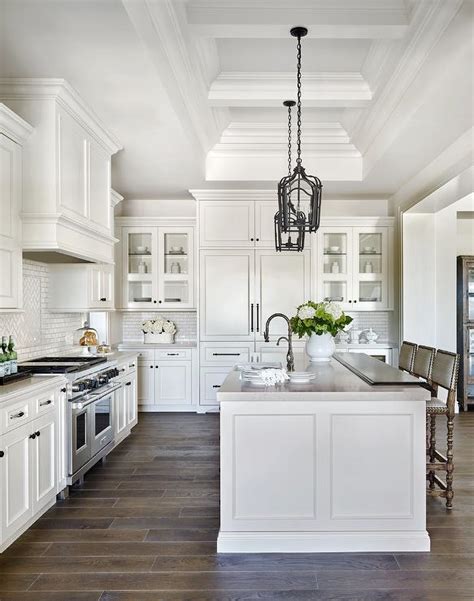 White Raised Panel Kitchen Cabinets With White Mini Subway Tile