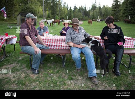Guests Enjoy A Barbeque At The Artemis Guest Ranch In Kalispell