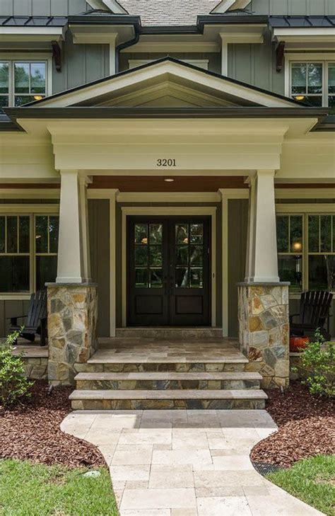 Melton classics offers porch columns in a limitless selection of designs including classically authentic, contemporary, and custom designs. Green custom home with a black front door and wood soffits ...