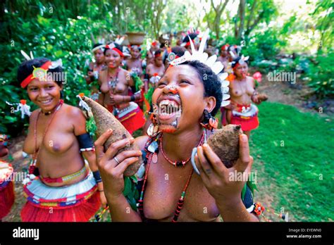 Trobriand Island Women In Traditional Costume Carrying Yams Trobriand Islands Papua New Guinea