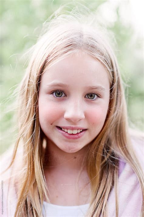 Smiling Portrait Of A Pre Teen Girl On A Summer Evening By Stocksy Contributor Angela Lumsden