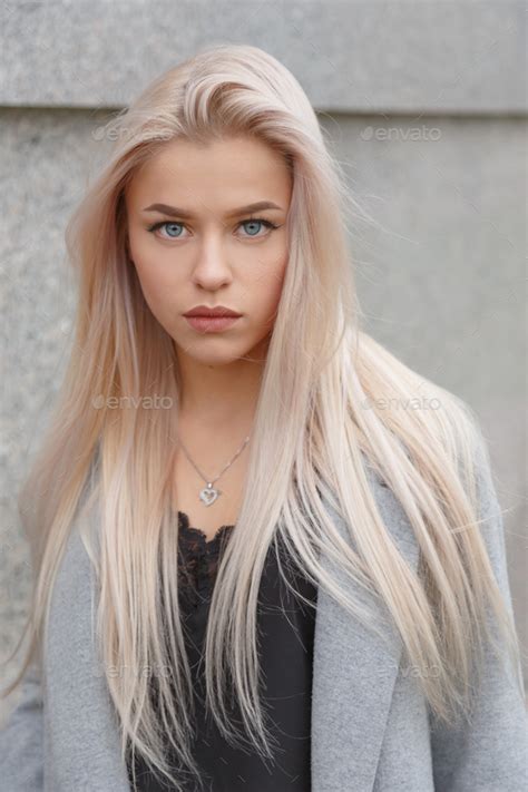 Stunning Blue Eyed Blond Woman Portrait Stock Photo By Vladdeep