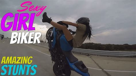 beautiful girl biker performs amazing highway motorcycle stunts riding long stunt bike wheelies