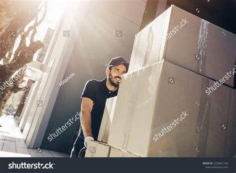 Pushing Boxes Over 18660 Royalty Free Licensable Stock Photos