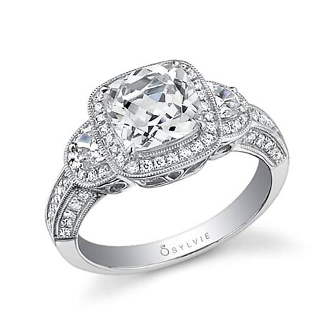 Tw.) (29) this exquisite antique style three stone trellis setting features interwoven prongs sweeping upward to embrace two brilliant round diamond side stones. Dominique - Three Stone Halo Engagement Ring - SY474
