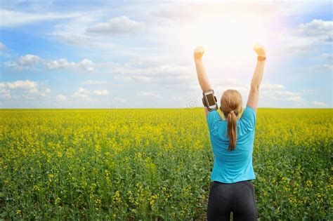 Successful Woman Runner Raising Arms To The Sun Stock Photo Image Of