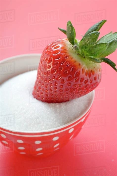 Strawberry Dipped In Sugar Stock Photo Dissolve