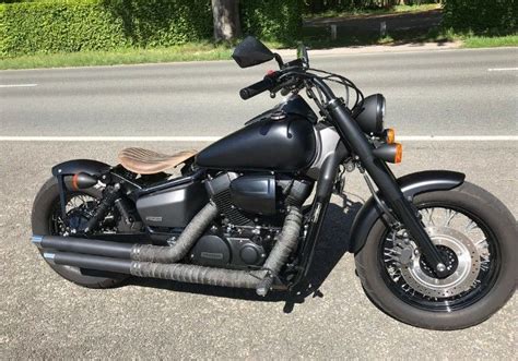 Check out the spoked wheels, black rims, bobbed fenders and matte black accents. Honda shadow phantom