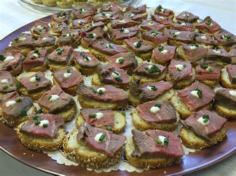 Place the roast in the center of the plastic wrap and wrap a bacon slice around one end of the roast. Beef Tenderloin Crostini - Catering by Debbi Covington ...
