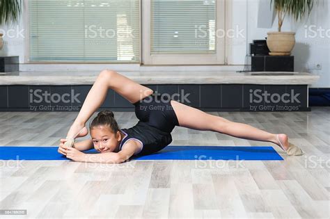Girl Gymnast Doing Splits In Gymnasium Stock Photo Download Image Now