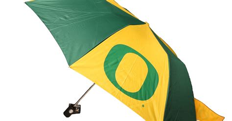 Oregon ducks 18'' x 18'' cross arrow decorative throw pillow. Gift ideas for Oregon Ducks sports fans
