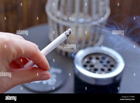 Lit Cigarette Woman Hand Smoke High Resolution Stock Photography And