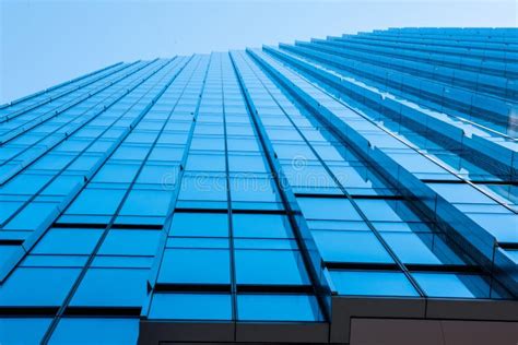 Modern Glass Facade Of An Office Building View From Below Stock Image