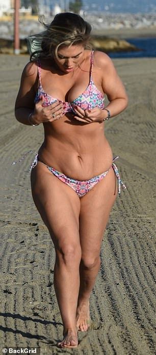 Frankie Essex Proudly Shows Off Her Curves In A Purple Patterned Bikini