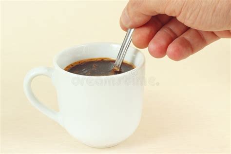 Hand Mixing With A Spoon Of Aromatic Coffee In Cup Stock Photo Image