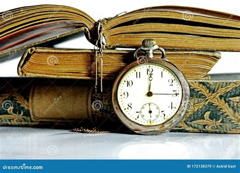 An Old Pocket Watch And Antique Books Stock Image Image Of Metal