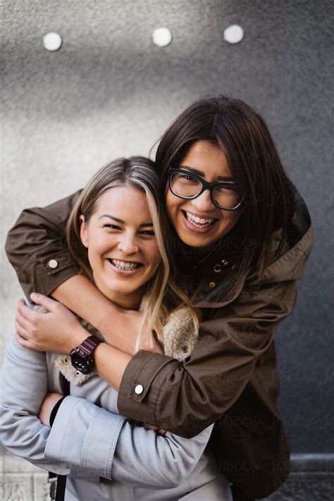 Two Female Friends Hugging And Smiling By Stocksy Contributor Katarina Radovic Stocksy