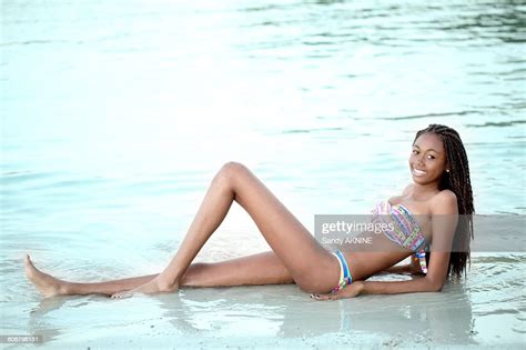 West Indian Smiling Young Girl In Swimsuit Photo Getty Images