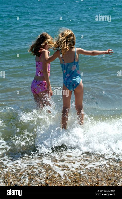 Little Girls Playing In The Sea At Seaside Southsea Southern England