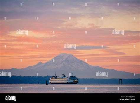 Ferry In Puget Sound And Mount Rainier At Sunset Washington Usa Stock