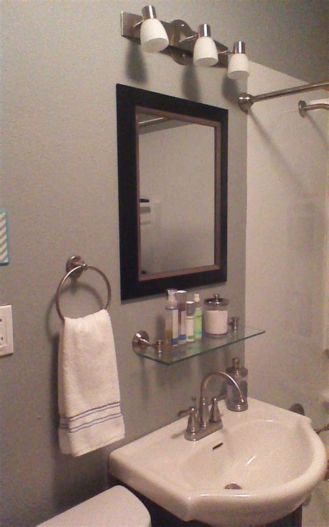 Glass shelves add an aura of sophistication and elegance while adding storage to your bathroom. After - added glass shelf under mirror | Bathroom mirror ...