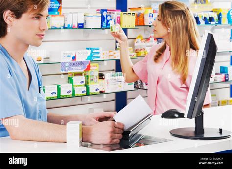 Two Pharmacists In A Pharmacy Stock Photo Alamy
