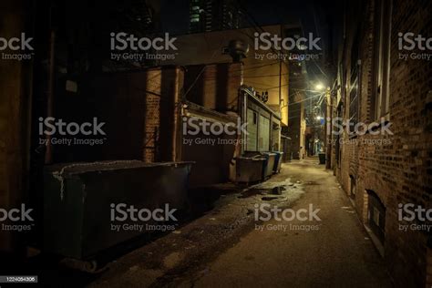 Dark And Eerie Urban City Alley At Night Stock Photo Download Image