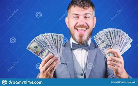Earning Much Profit. Rich Businessman With Us Dollars Banknotes. Currency Broker With Bundle Of ...