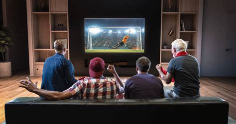 Watching Football On Tv Stock Photos Pictures And Royalty Free Images